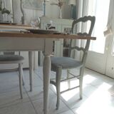 Farmhouse table with pearl gray base and raw wood top.