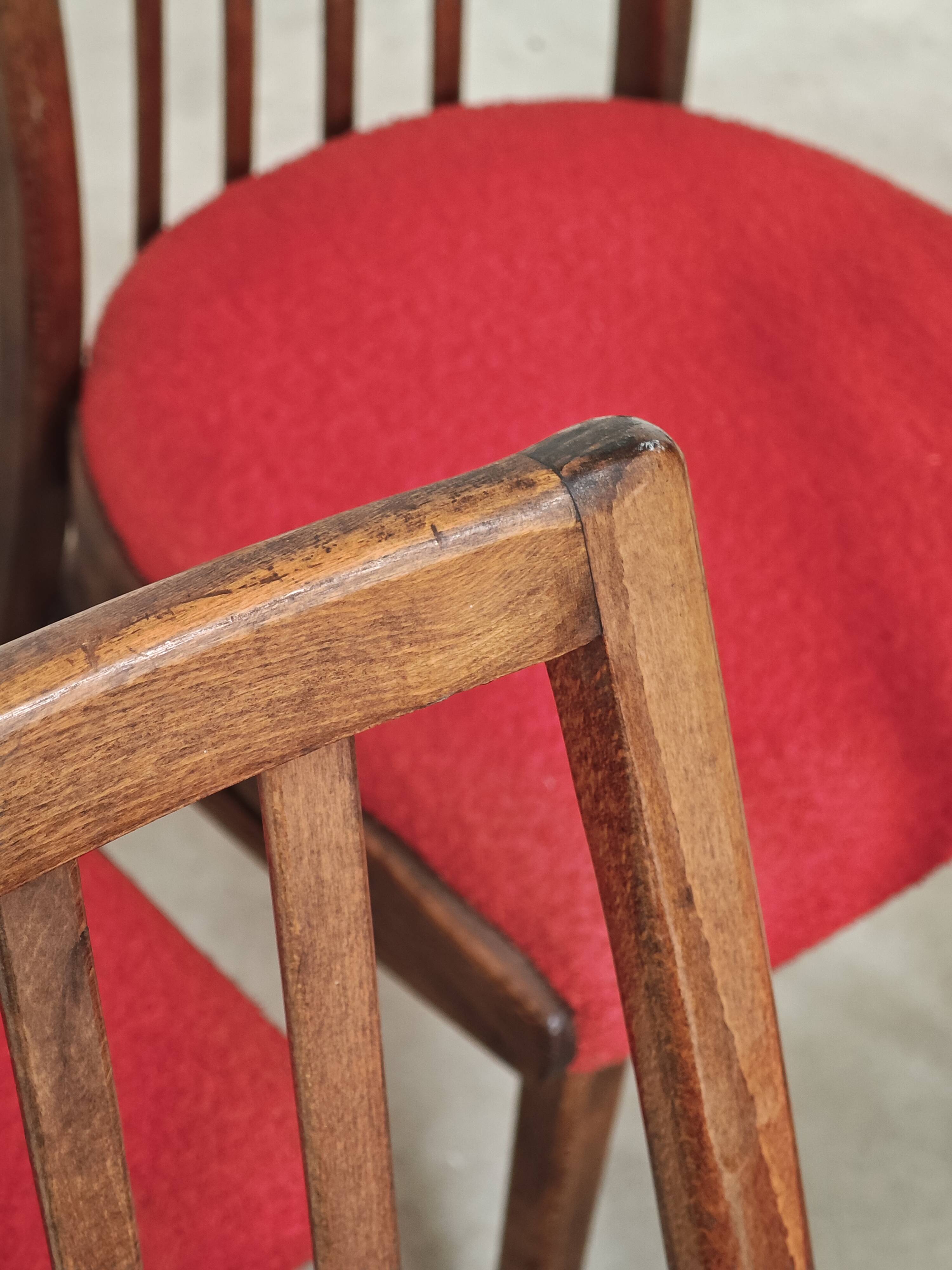 Set of 4 red dining chairs by Antonin Suman for Interier Praha.