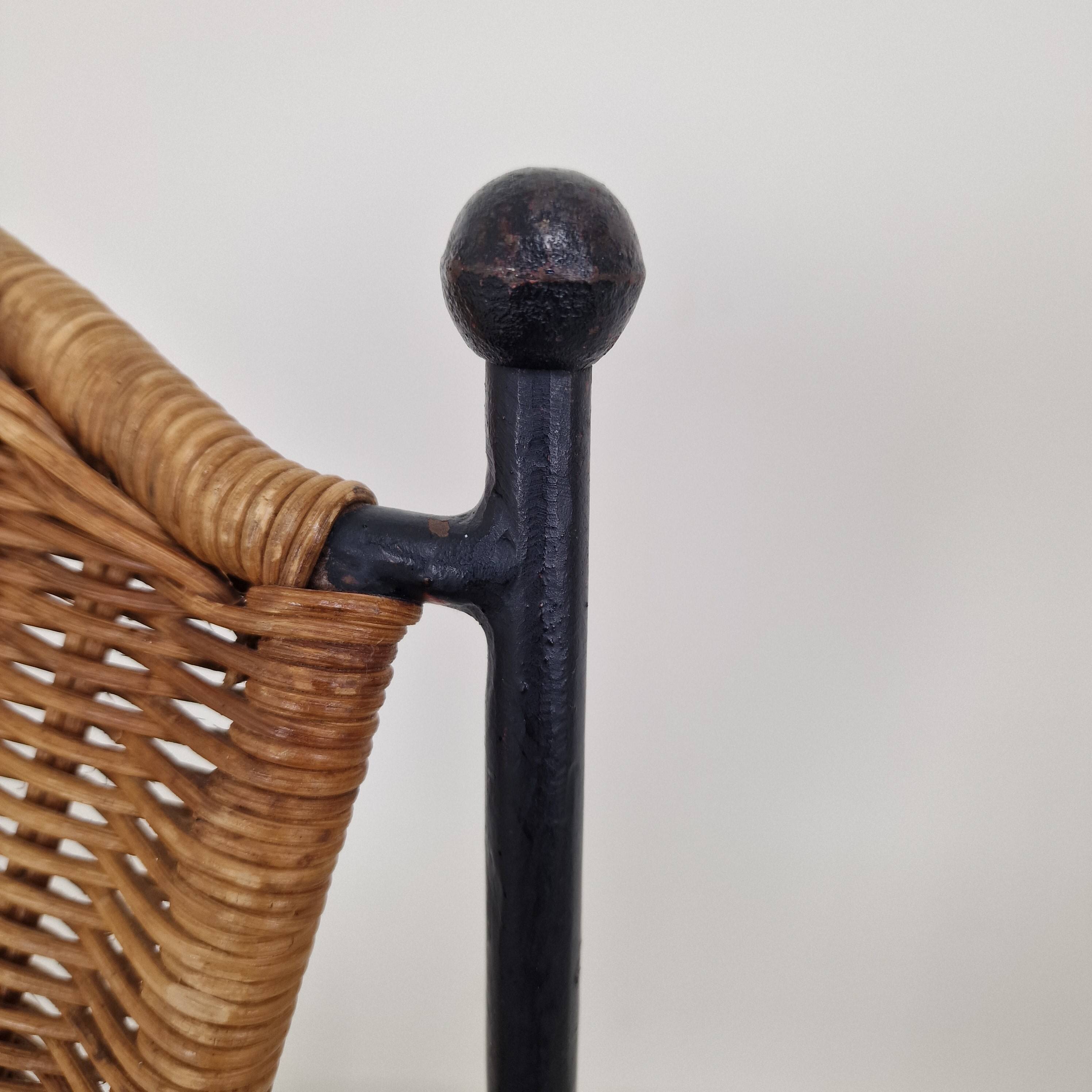 Pair of wicker and iron armchairs by Frederic Weinberg, United States, 1950s.