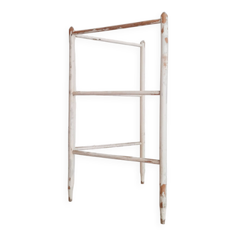 Old towel rack in patinated white wood