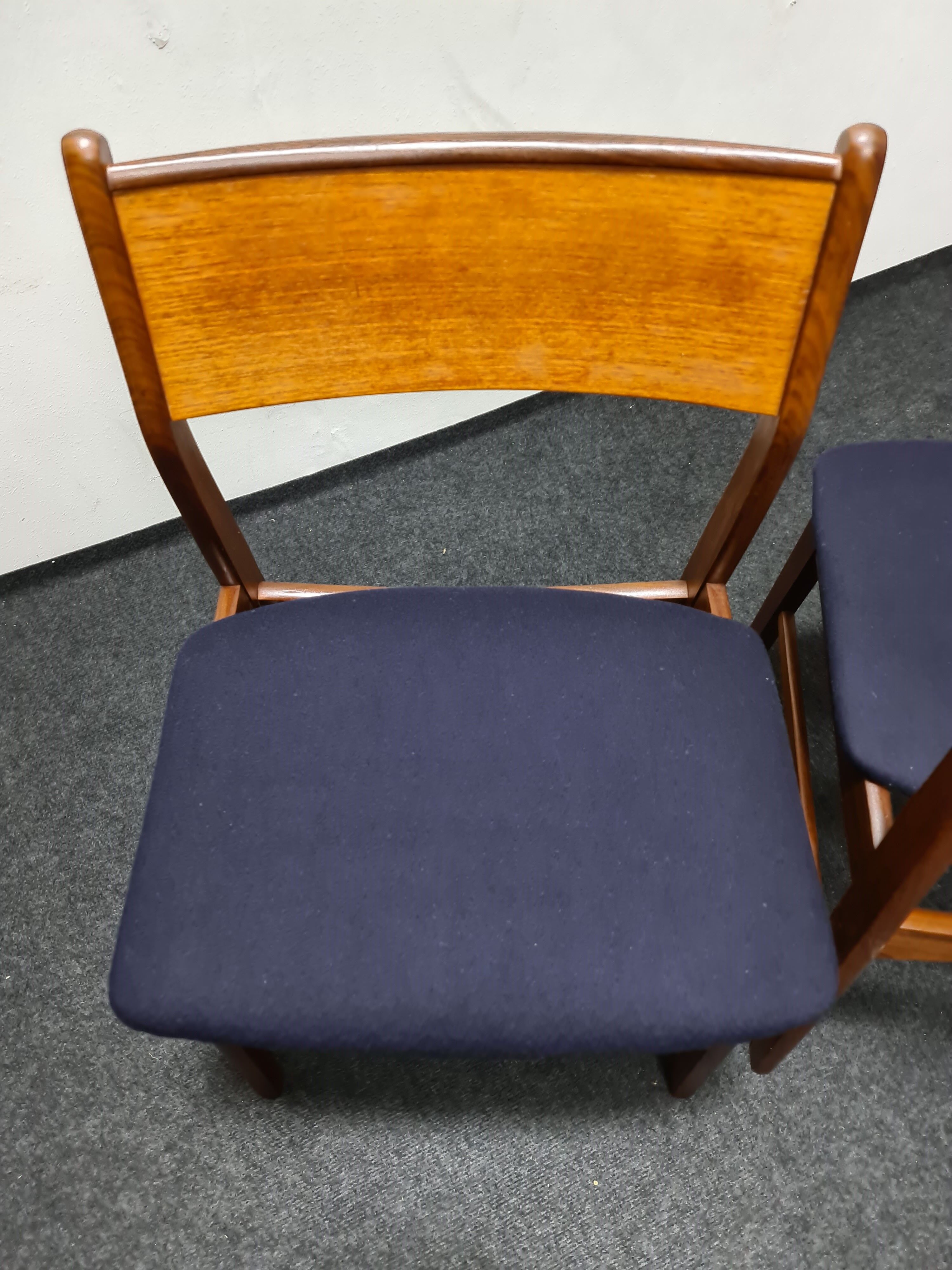 A pair of vintage teak dinning chairs