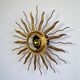 Brutalist sunburst ceiling light – gilt iron rays & exposed bulb, France, 1960s