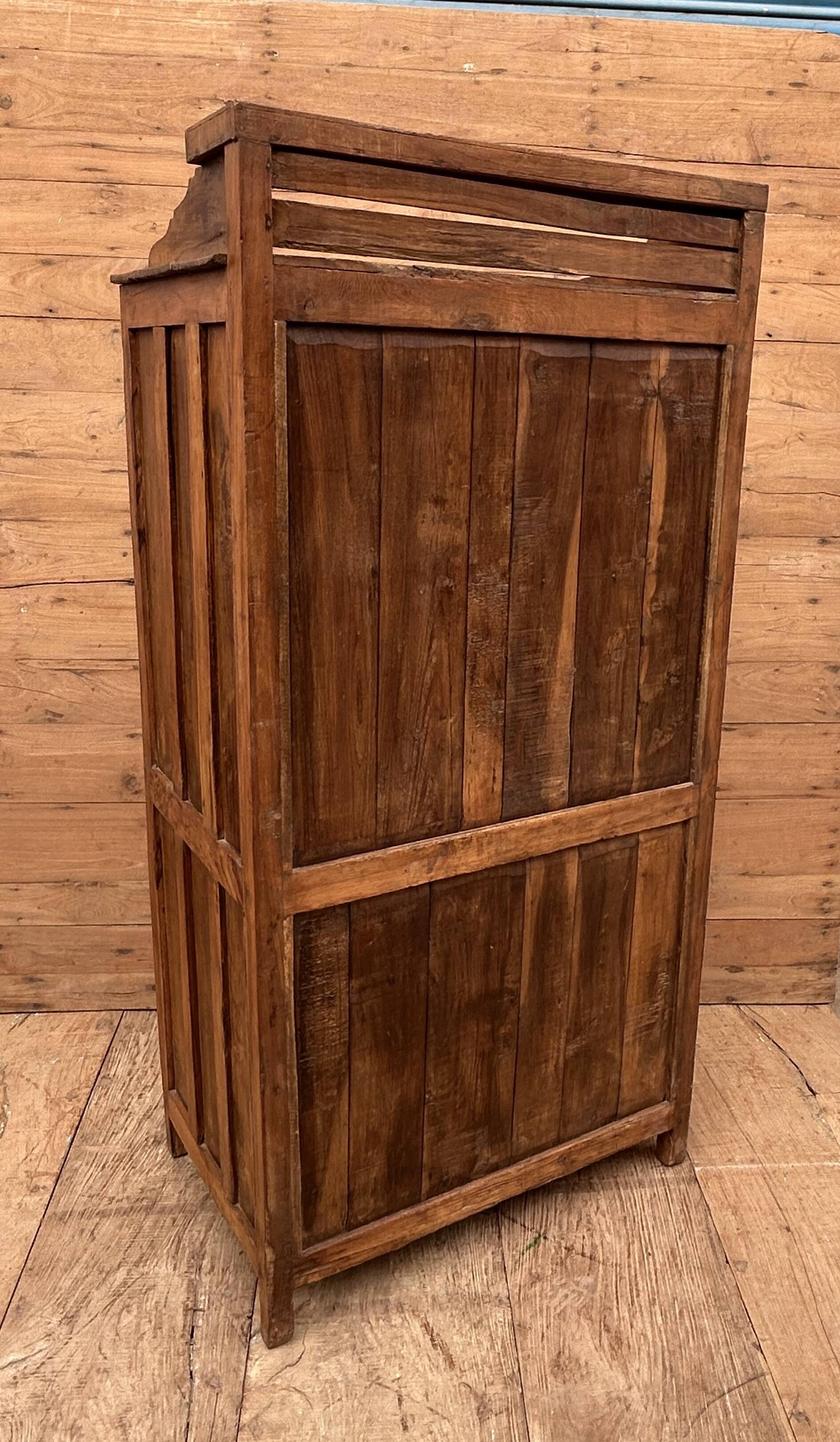 Art Deco glass-fronted cabinet in Burmese teak with original patina.
