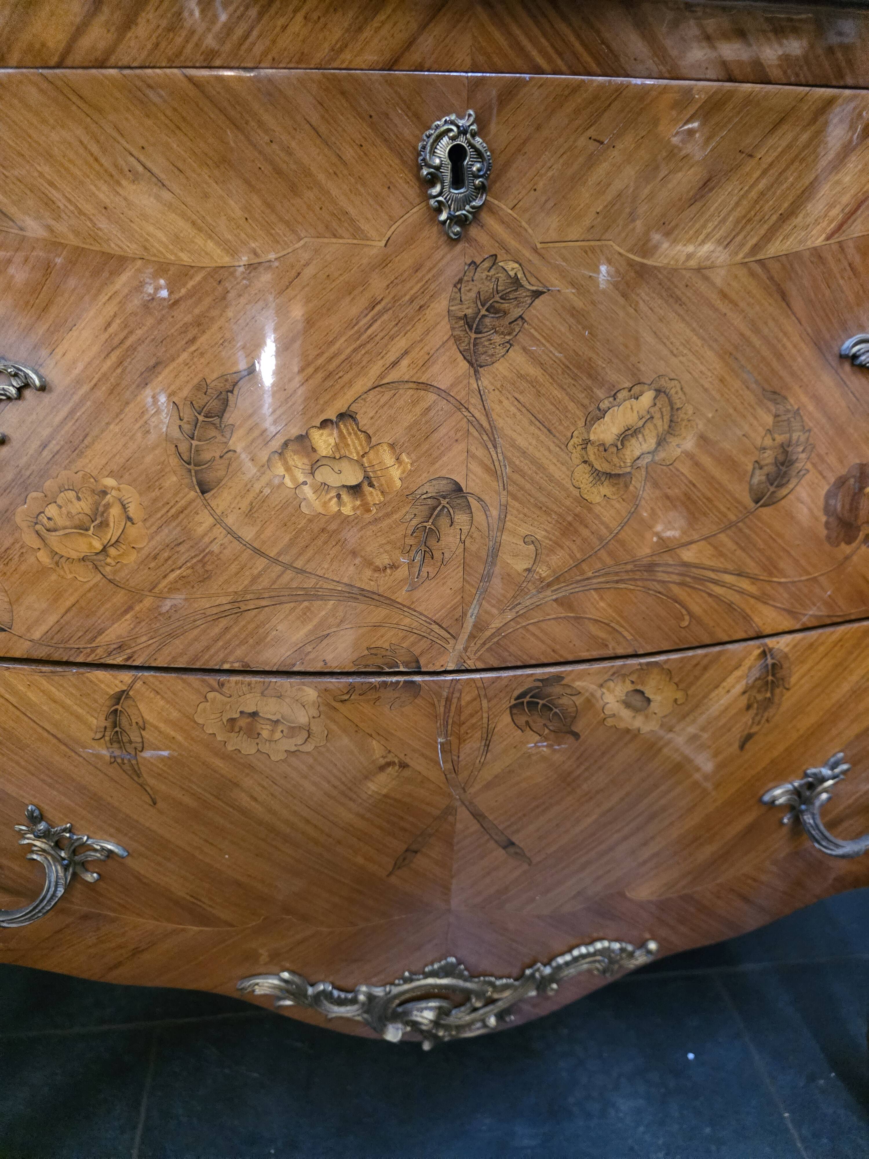 Louis XV style curved chest of drawers in marquetry