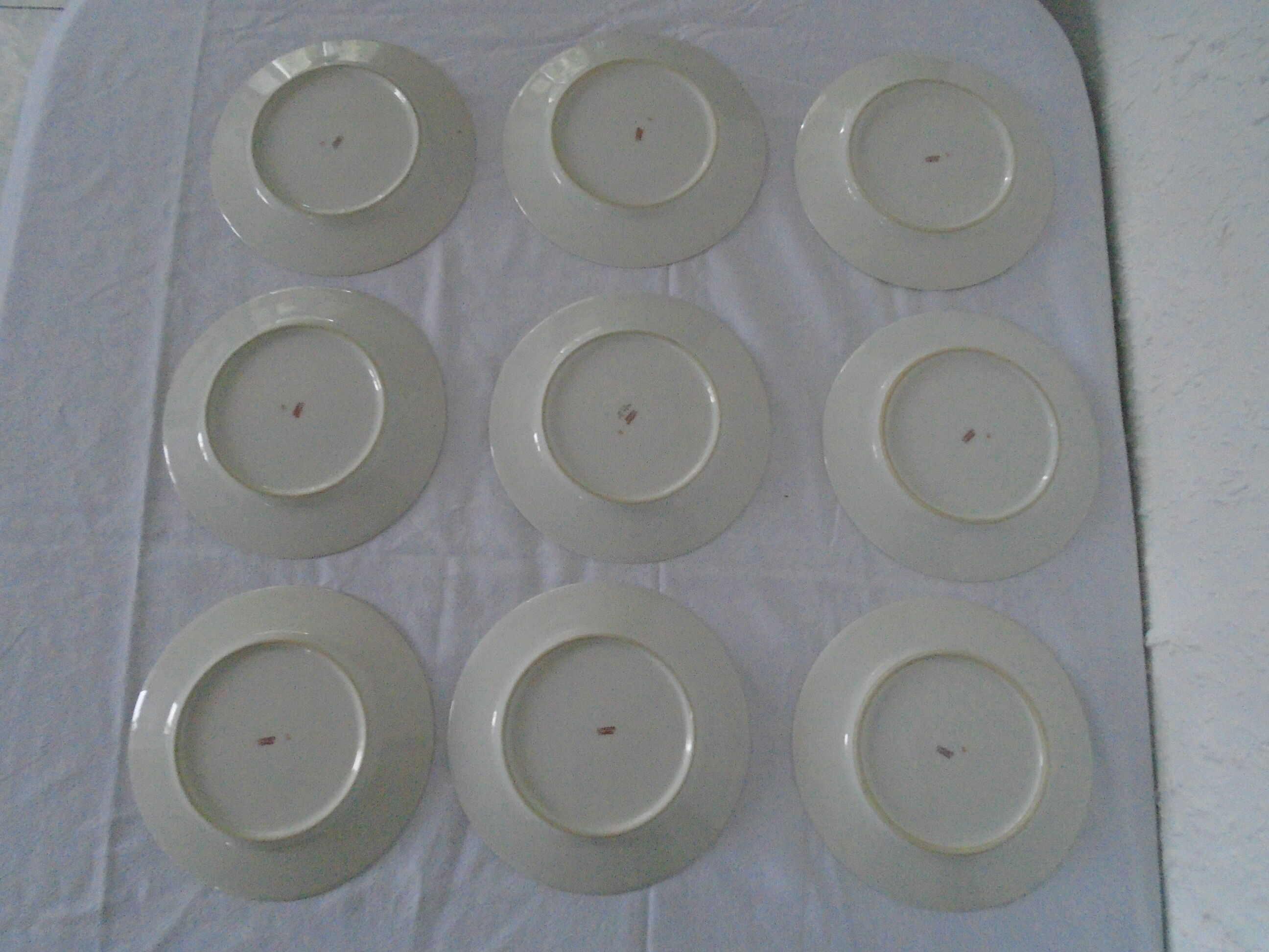 9 plates dessert porcelain of Limoges decorated with small blue flowers