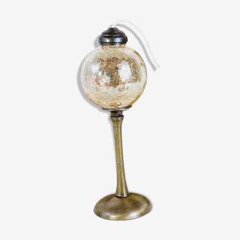 Brass oil lamp and cracked glass