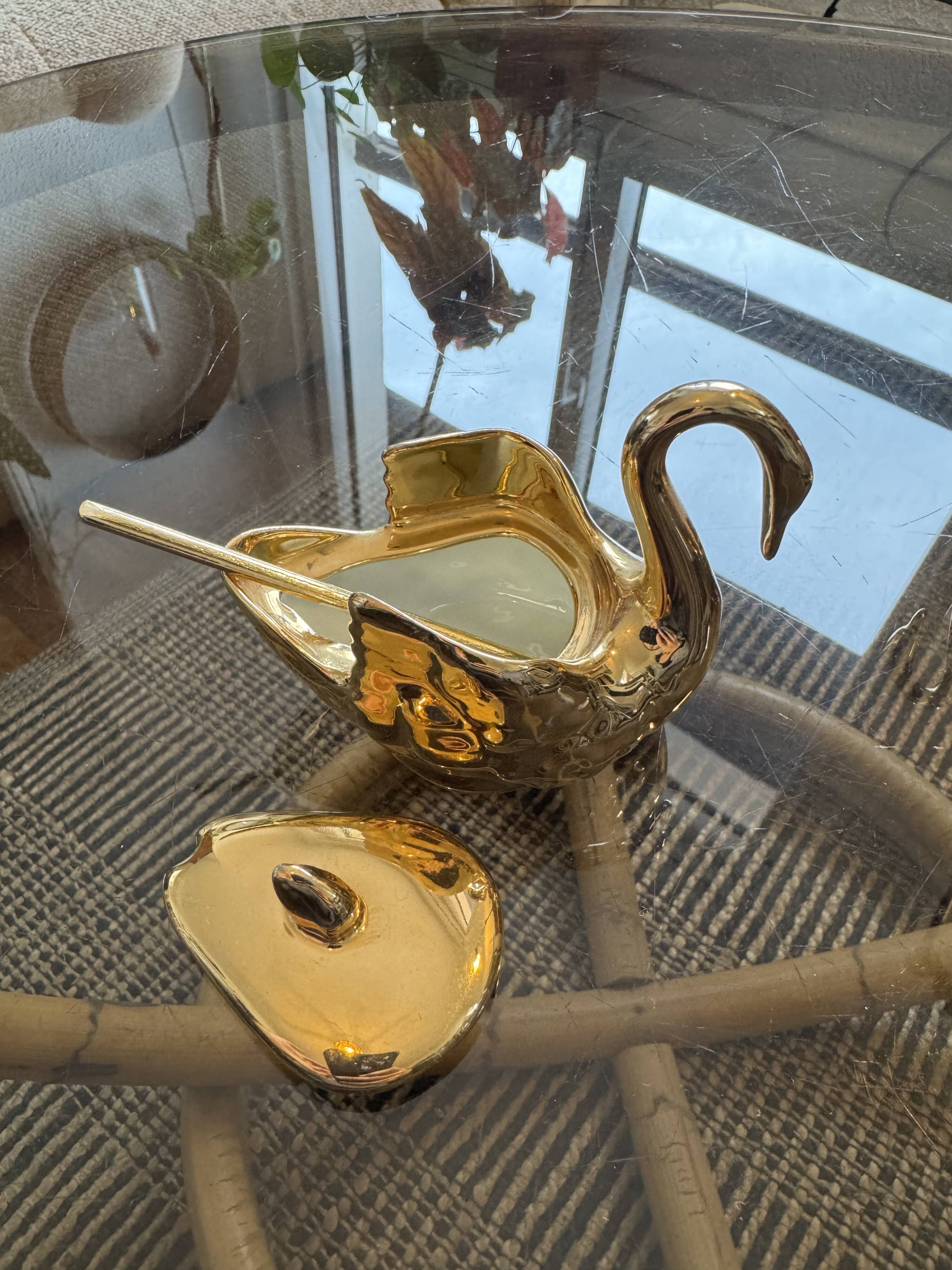 Pair of golden salt cellars in Limoges porcelain shaped like swans