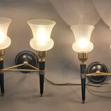 Pair of two-light torchiere wall lights in black lacquered metal and gilded brass, Circa 1960.