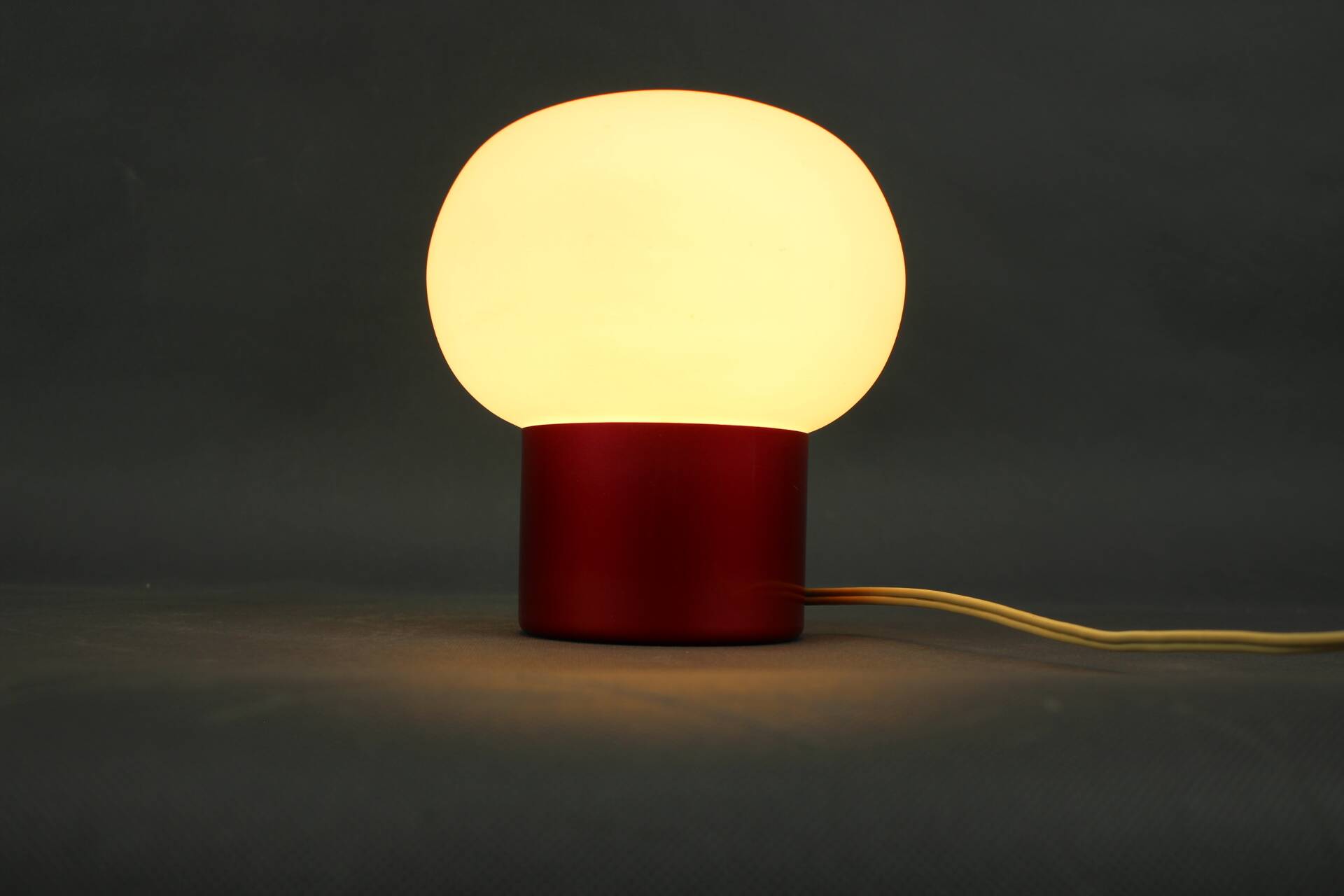 Burgundy Red opaline glass table lamp from the 1970s space age.