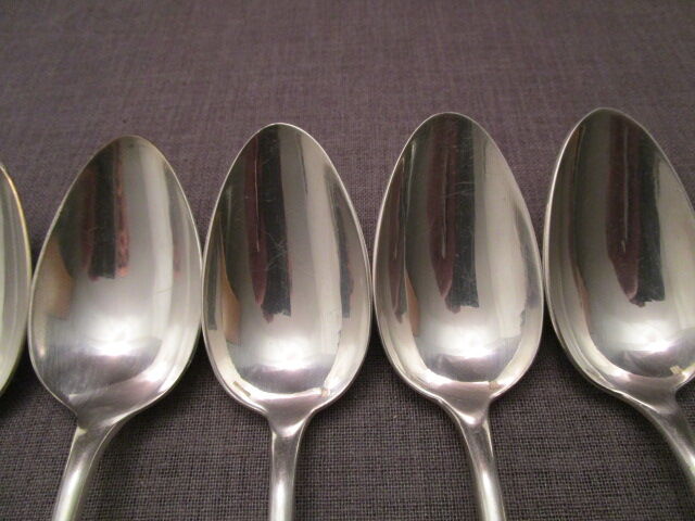6 old silver metal spoons mismatched for a chic table