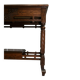 19th-century carved walnut desk with a leather top.