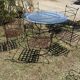 Wrought iron table and chairs for indoor/outdoor use.
