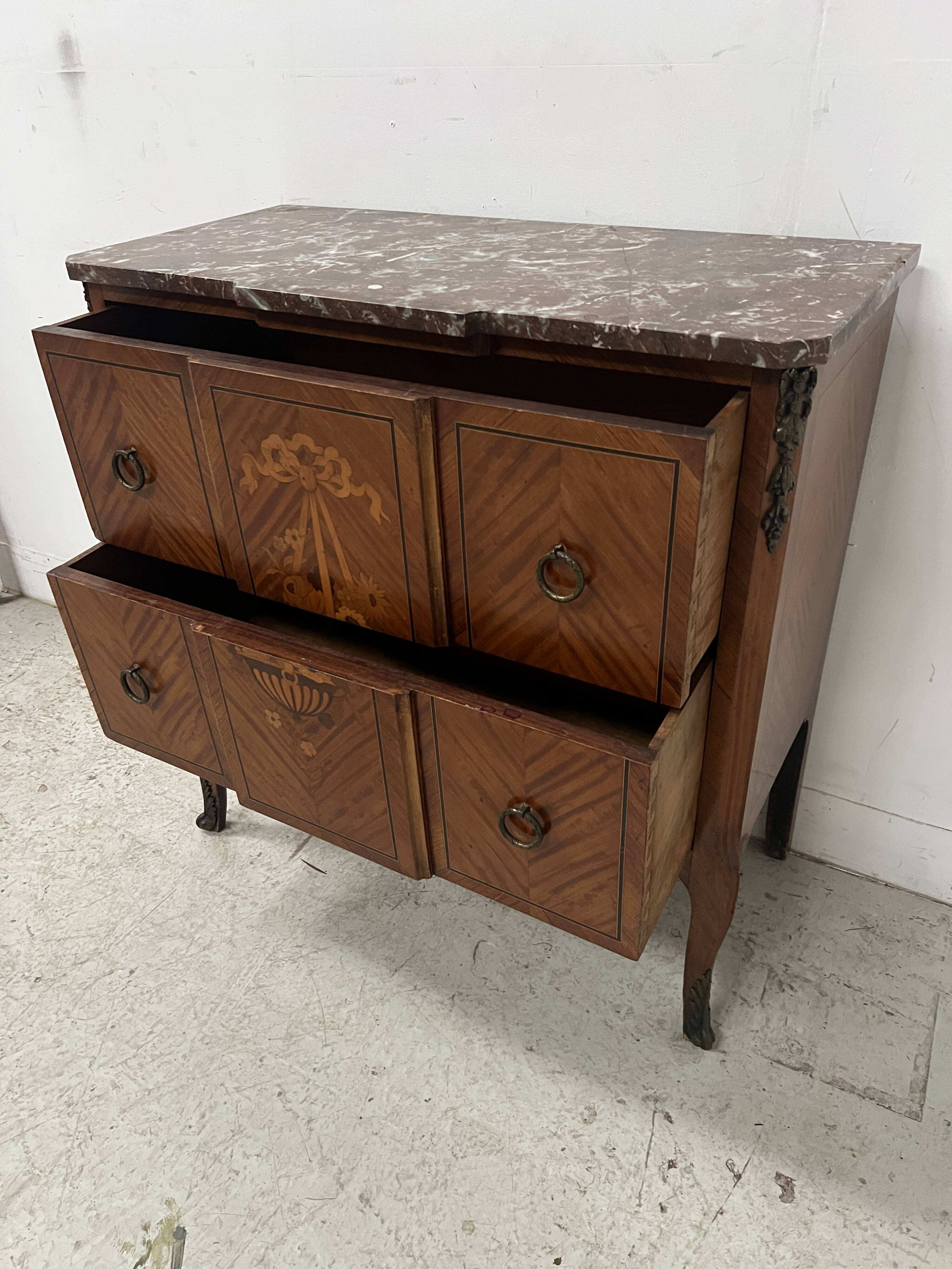 Transitional style commode with a protruding front, in marquetry wood, 20th century.