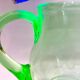 Art Deco carafe and its two glasses, in uraline