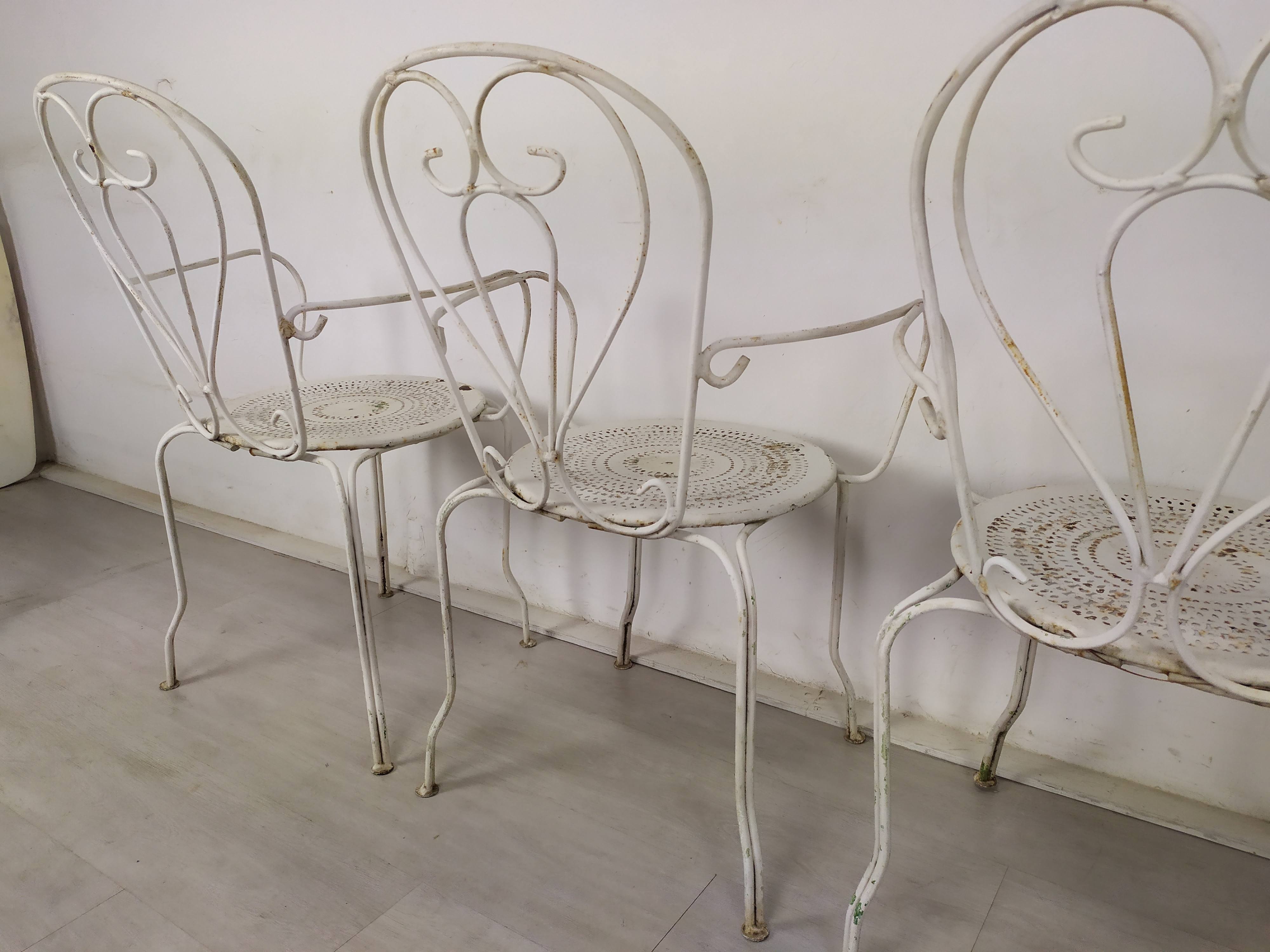 4 wrought iron garden armchairs