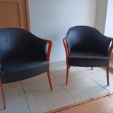 Pair of leather and wood armchairs in the Umberto Asnago style.