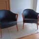 Pair of leather and wood armchairs in the style of Umberto Asnago.