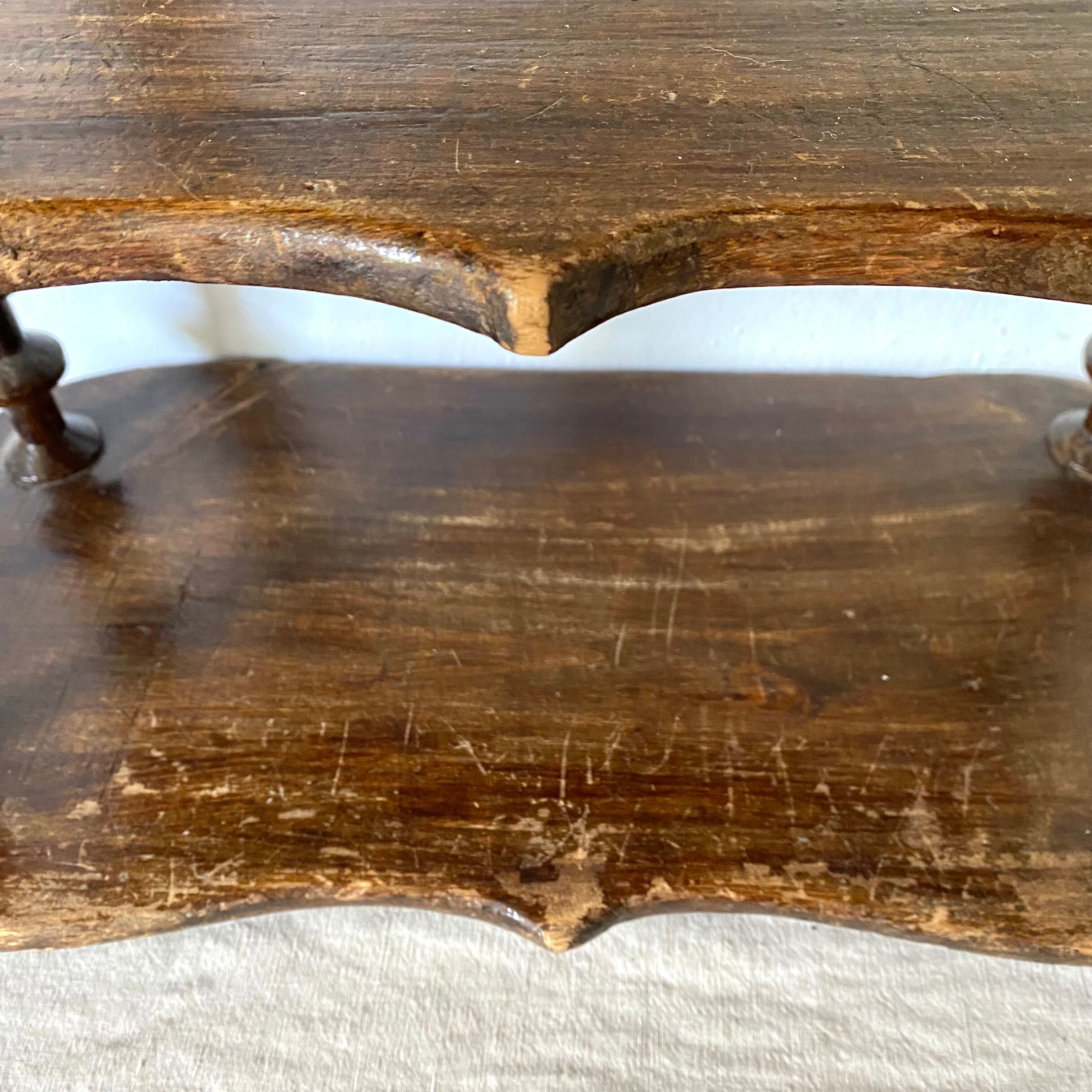 Old shelf in turned wood like reels