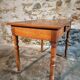 French vintage side table in cherry wood with a drawer.