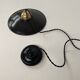 Old black enamelled industrial suspension