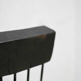Brutalist chair, black-stained raw wood, steel. Work from the 1970s