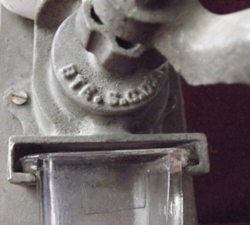 Old wall-mounted coffee grinder