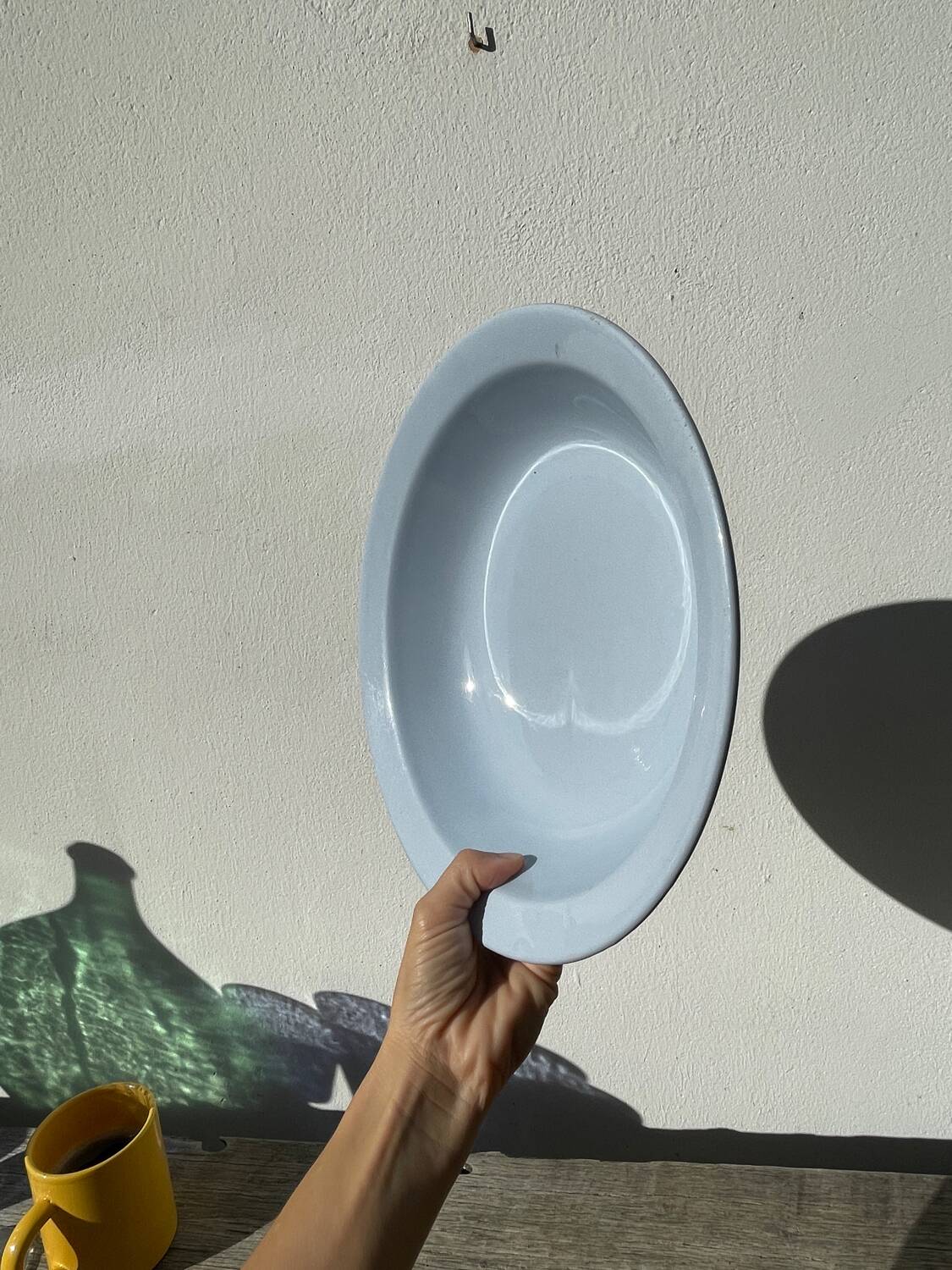 Round, flat, sky-blue ceramic salad bowl from Moulin des Loups