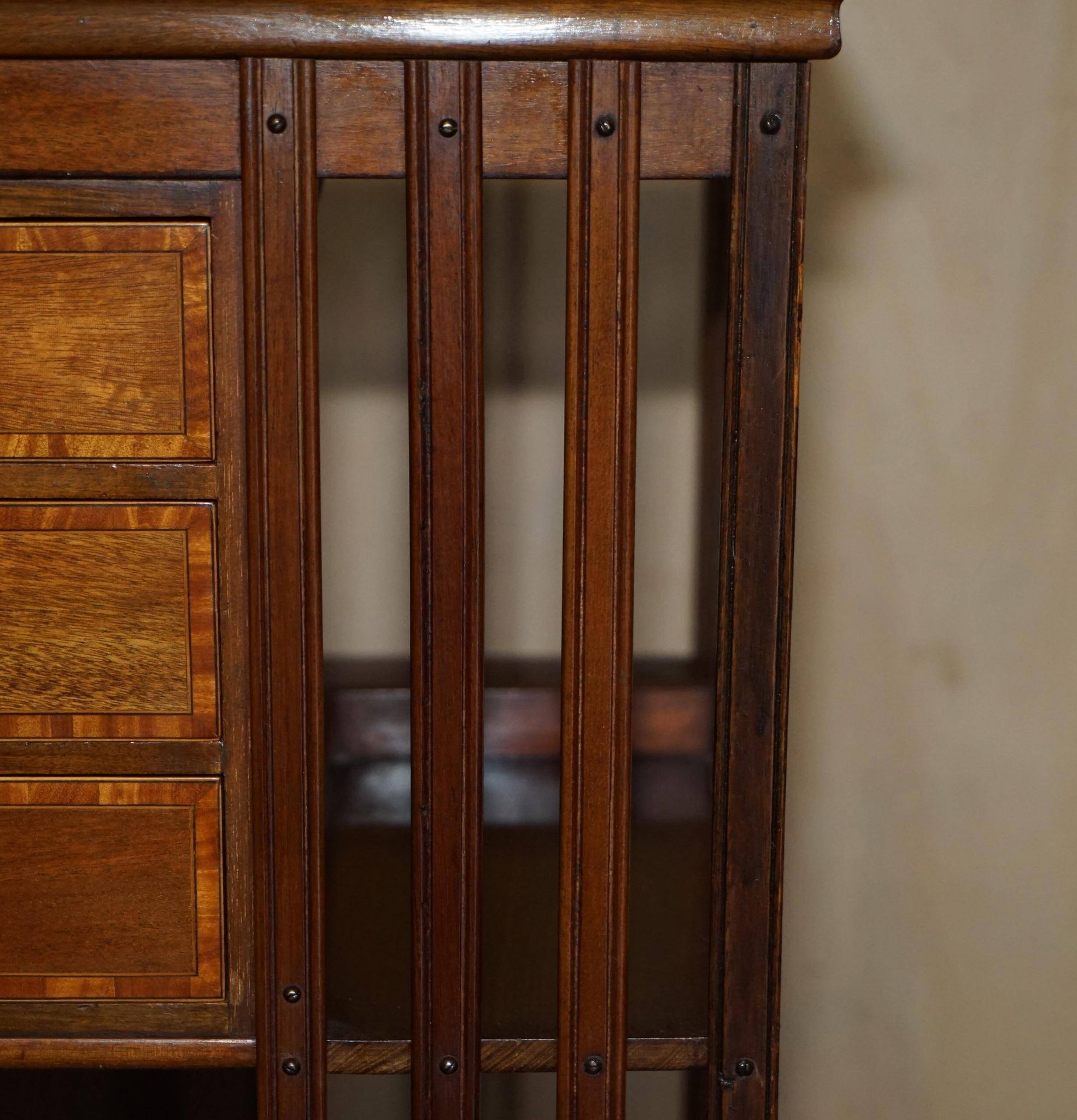 Restored Victorian walnut revolving library.