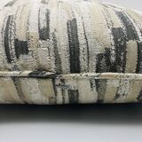 Coussin carré à bords passepoilés