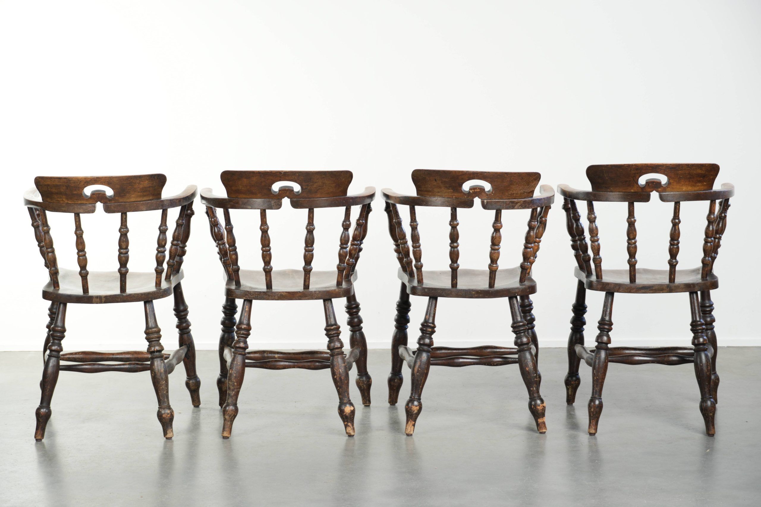 Set of four wooden English antique pub/captain chairs from the 19th century