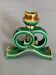 Green and gold candle holders in glazed ceramic