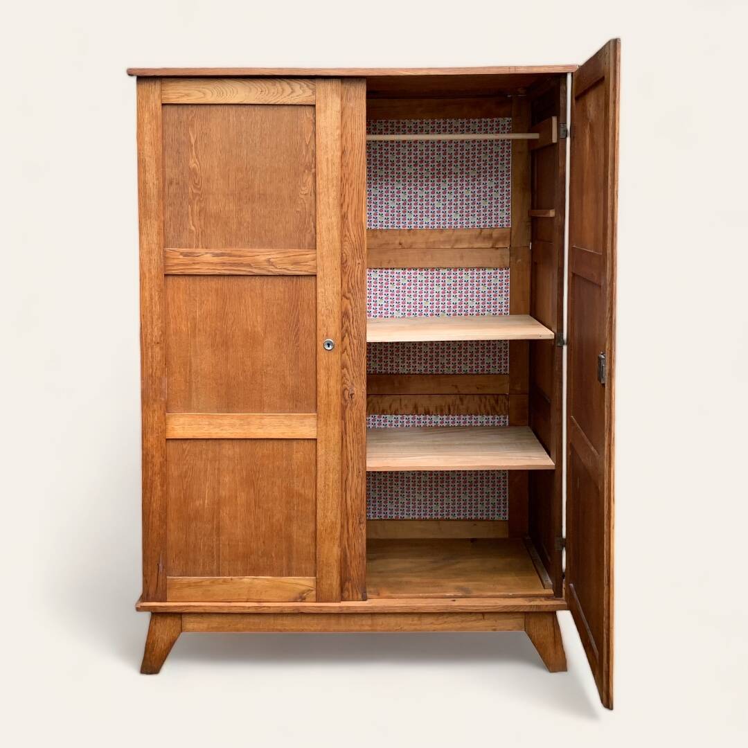 Solid oak compass foot cabinet René Gabriel 1945
