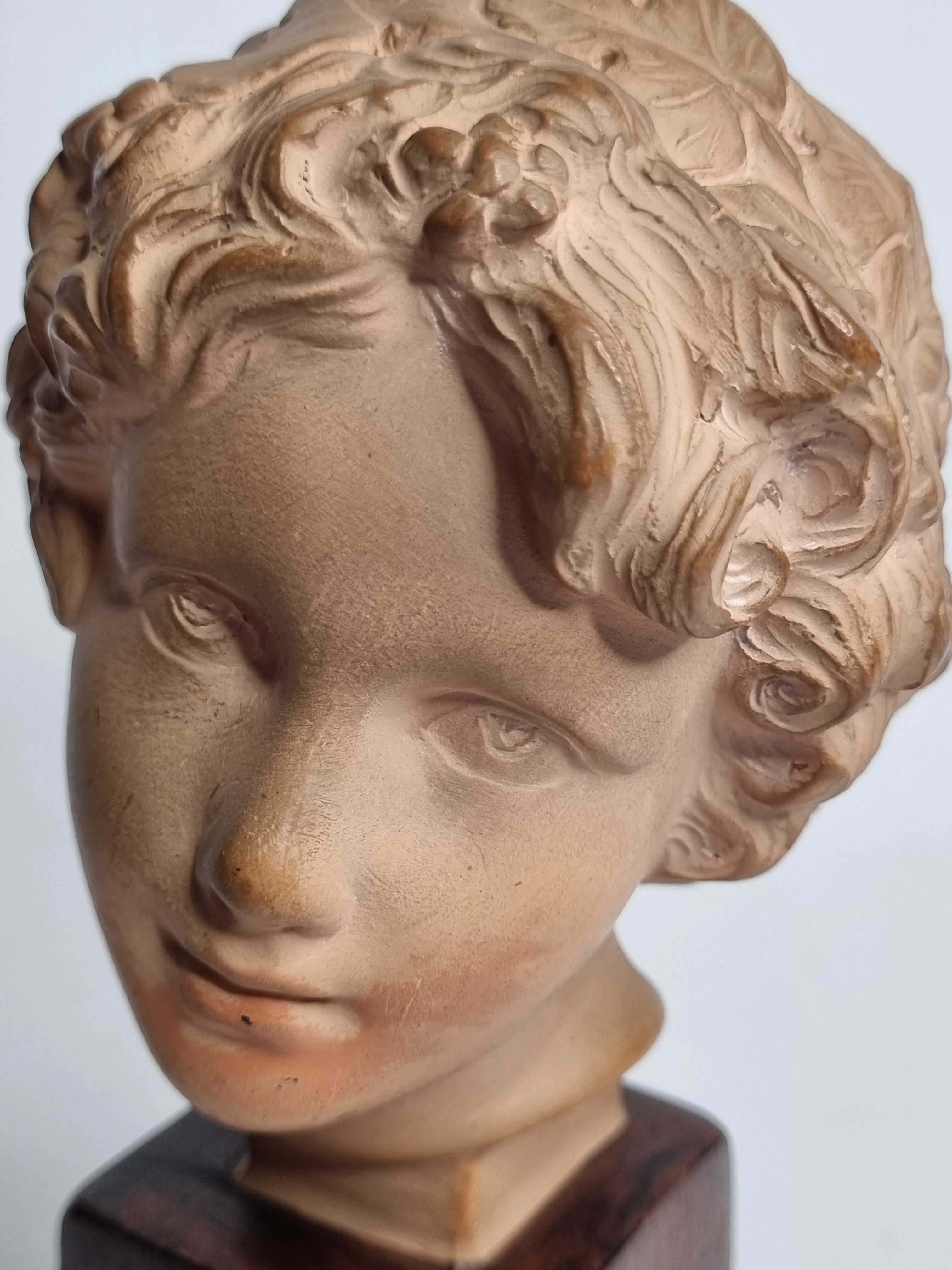 Bust of Bacchus child in patinated terracotta, 21 cm