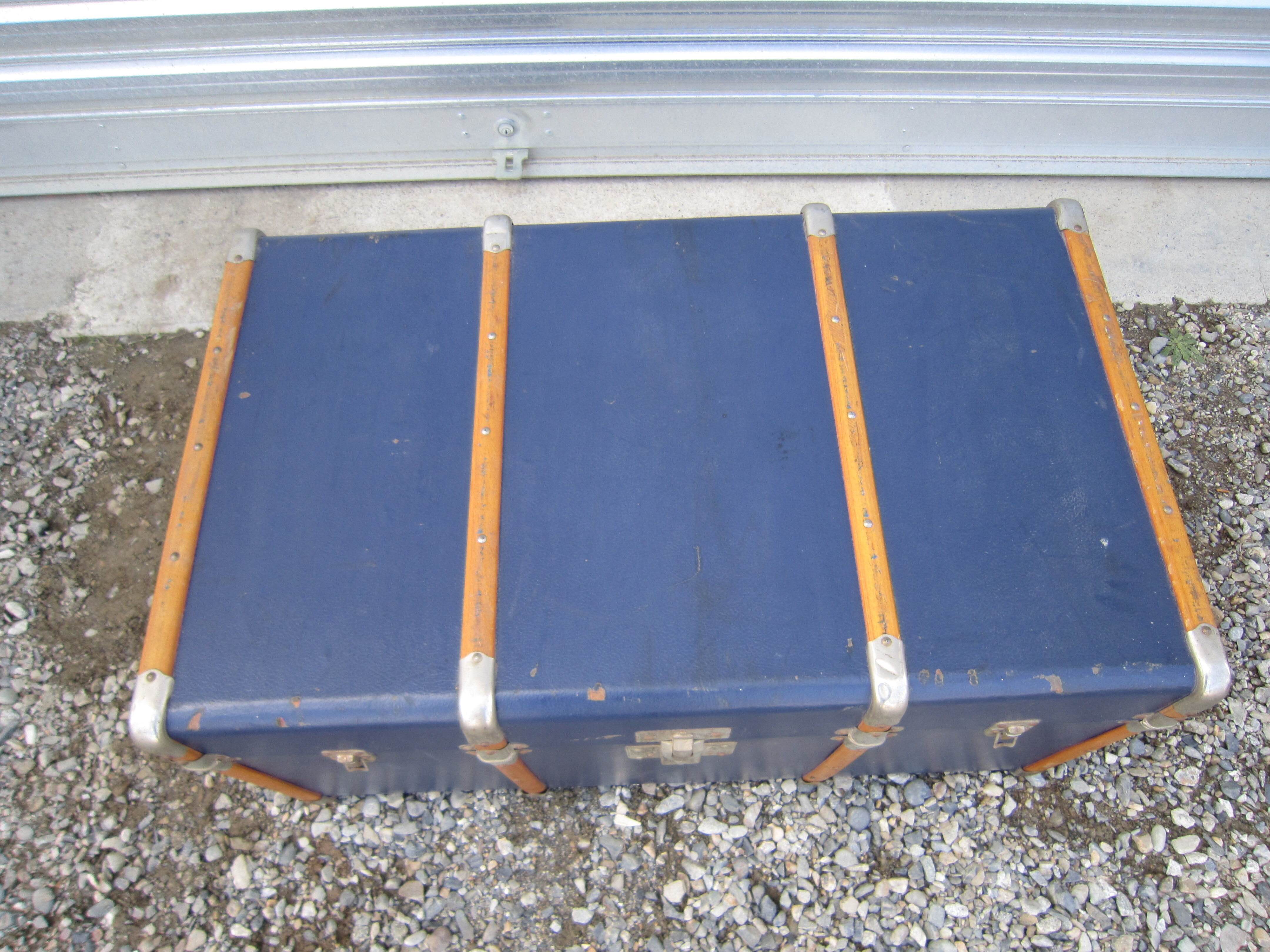 Old blue travel trunk handle leather