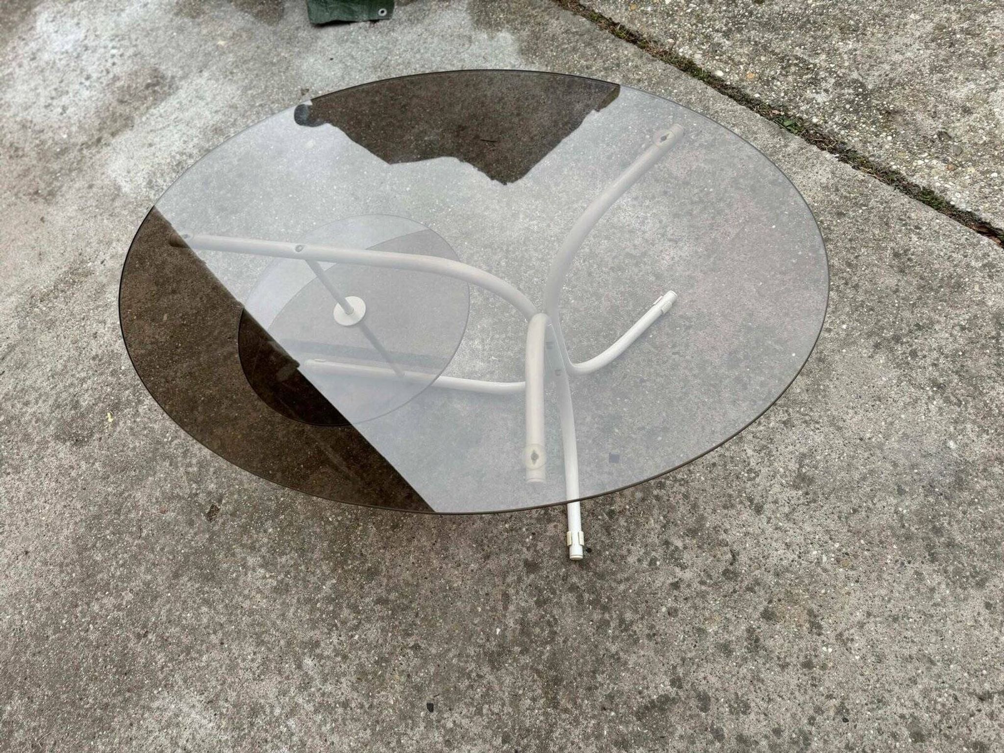 Coffee oval table with metal legs and smoky glass top, 1990s