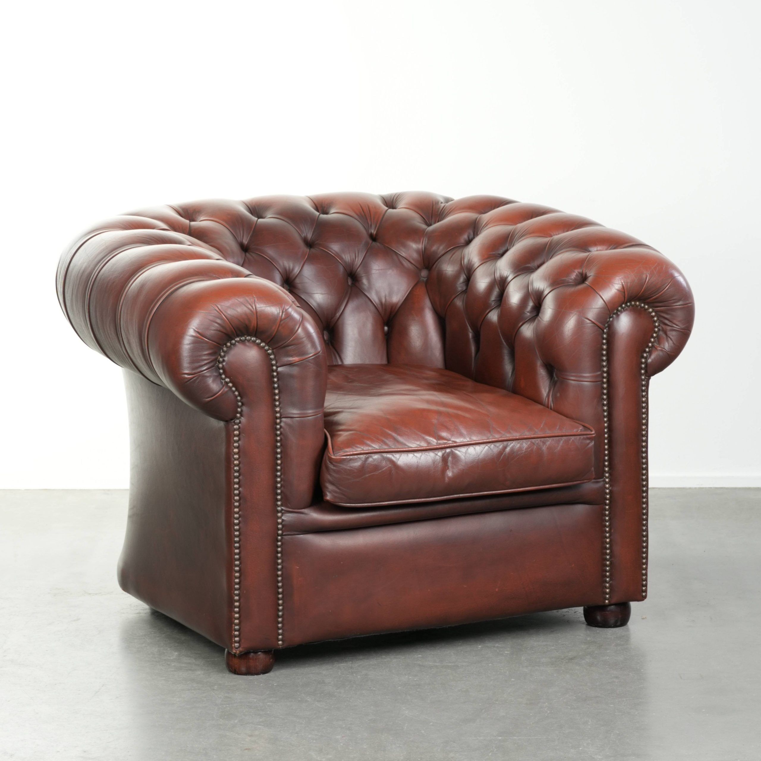 Cowhide Chesterfield armchair in a classic English style