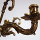 Pair of cherub candle holders in gilded bronze, early 20th century.