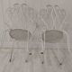 Pair of wrought iron garden chairs