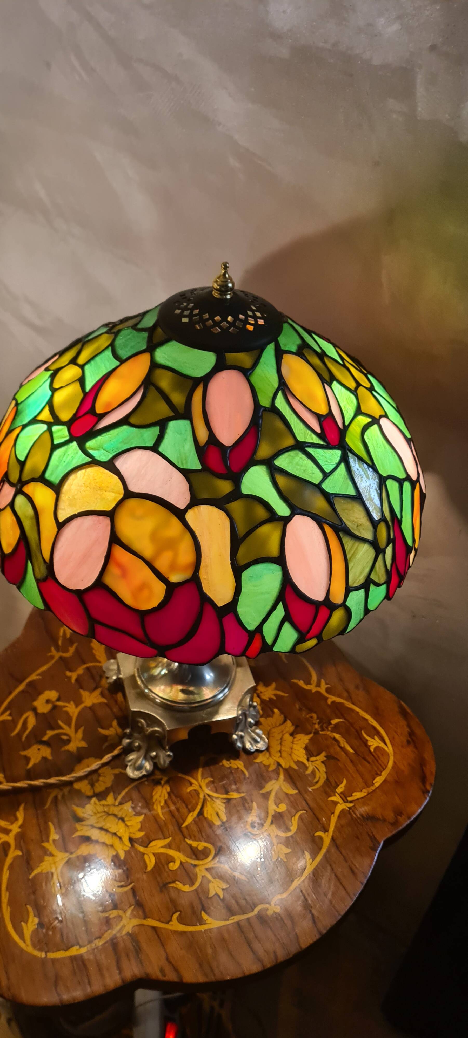 Antique bronze lamp and Tiffany-style stained glass shade. 46x32