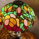 Antique bronze lamp and Tiffany-style stained glass shade. 46x32