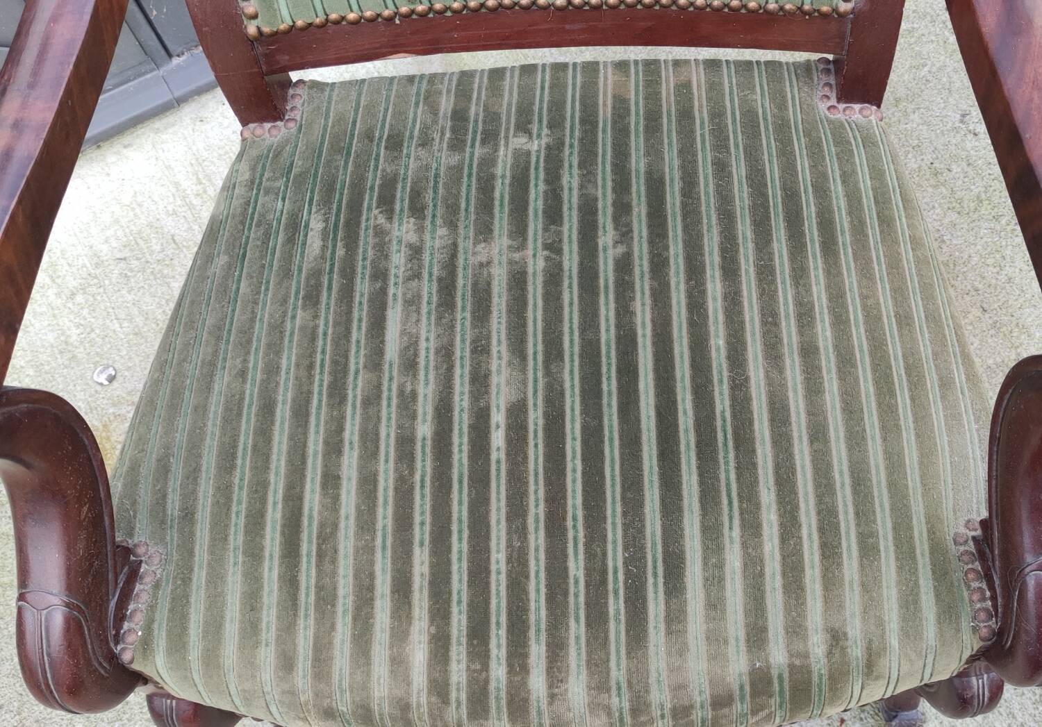 Old green velvet armchair
