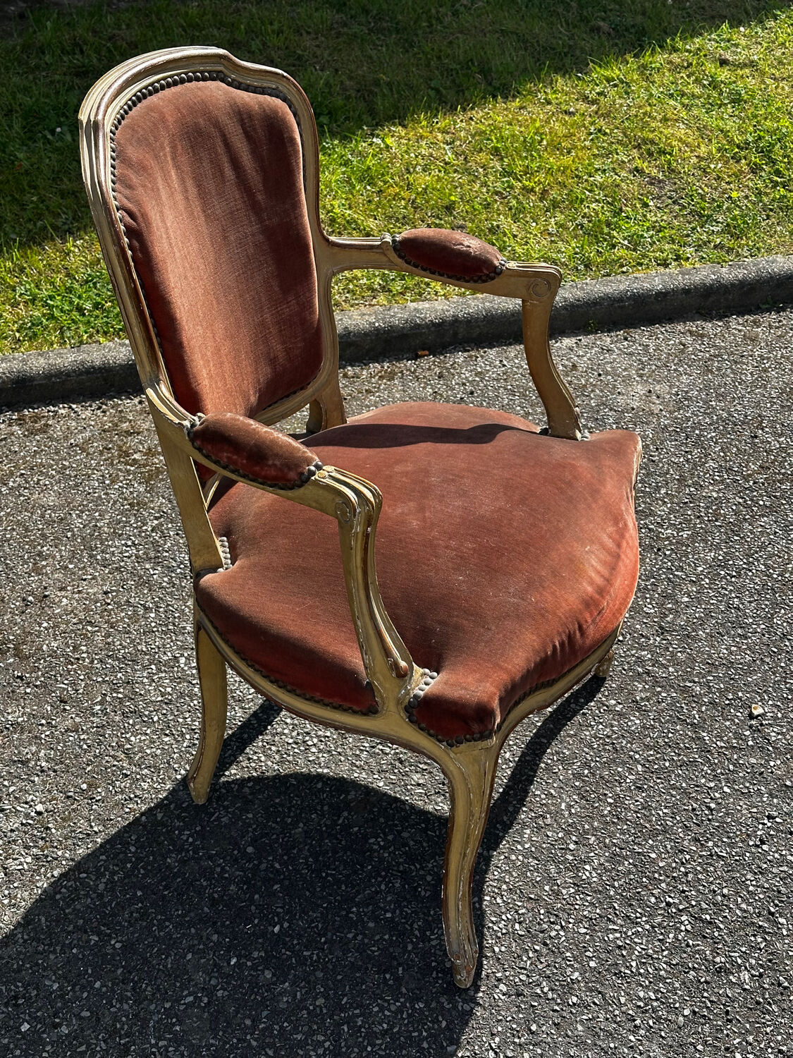 Louis XV cabriolet armchair, patinated wood and antique velvet.