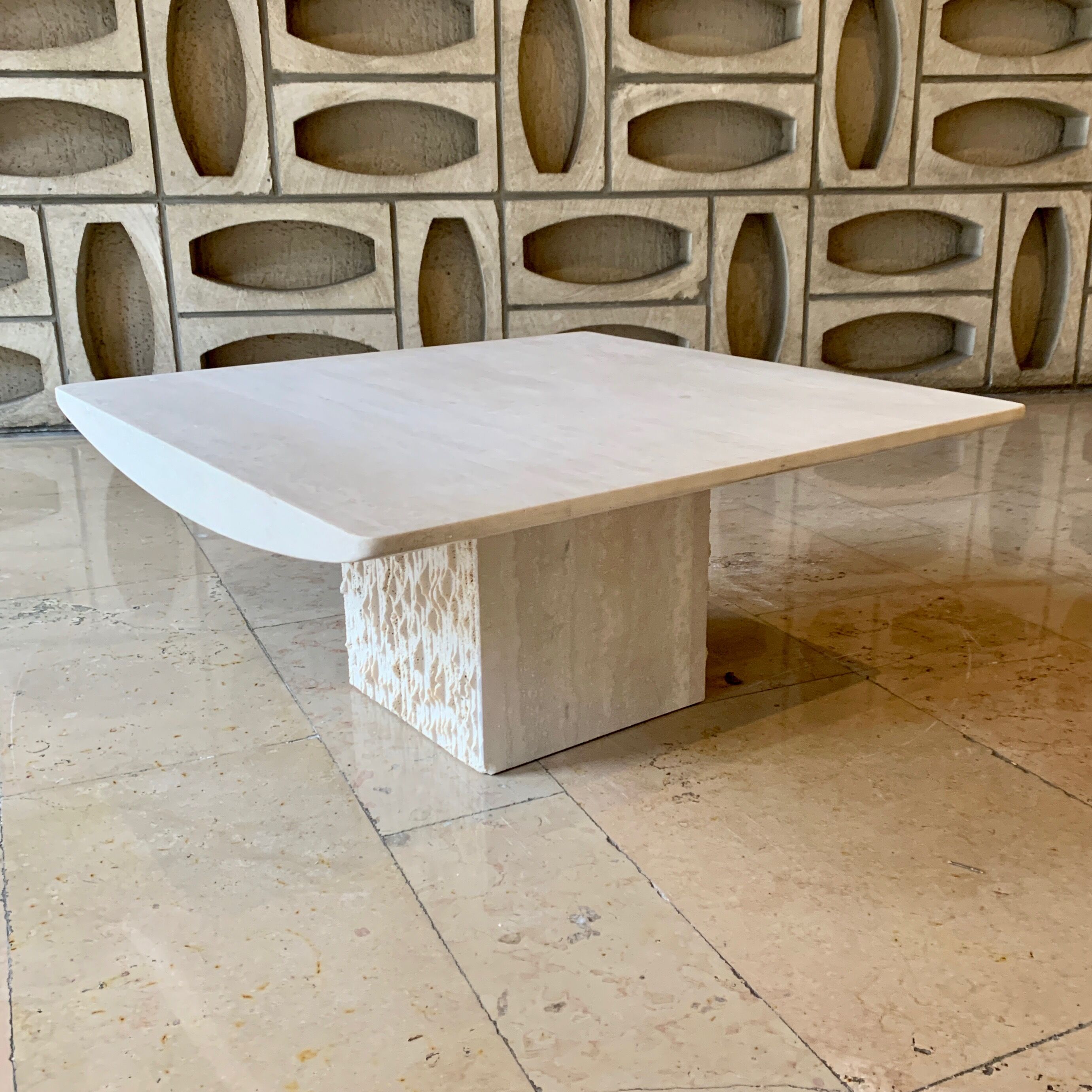Square coffee table in softened travertine