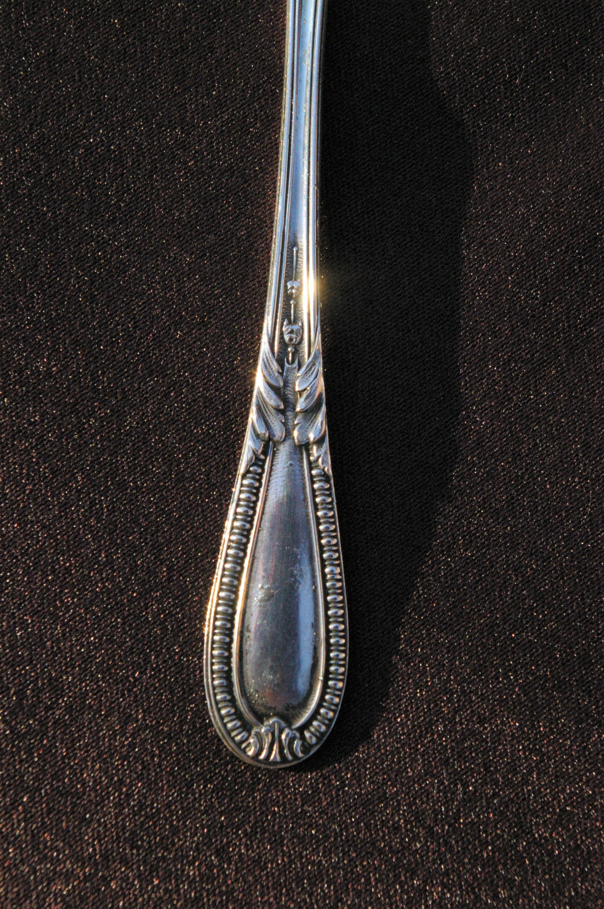 Egg spoon in solid silver and vermeil