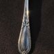 Egg spoon in solid silver and vermeil