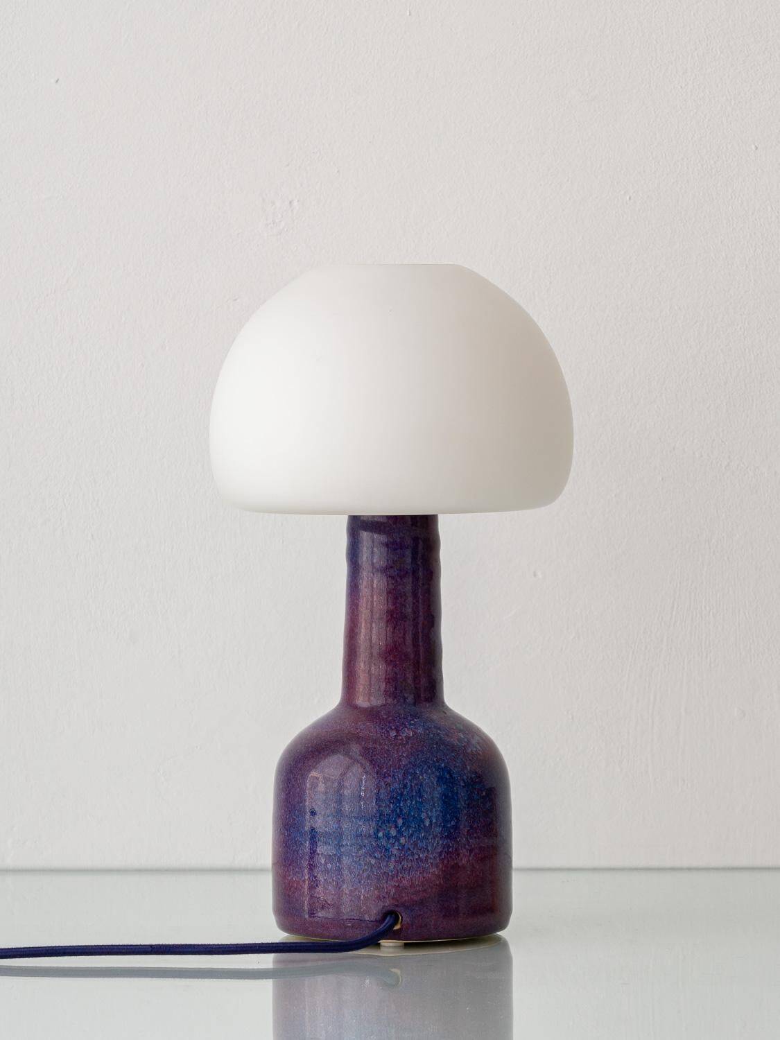 Mid-century modern table lamp by Jaap Ravelli, ceramic base and glass shade.