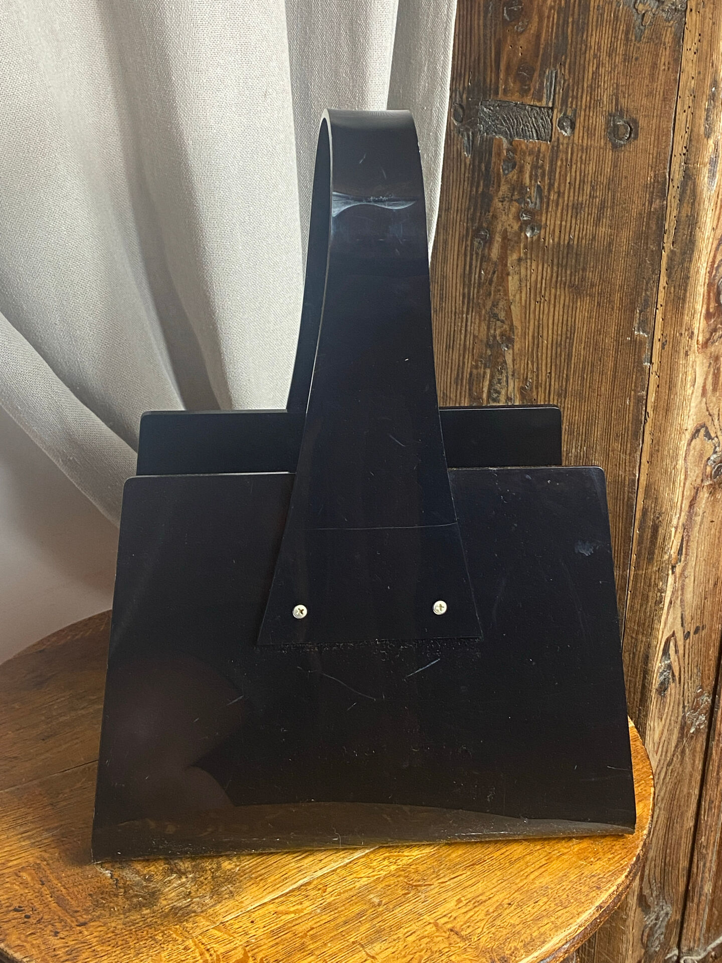 Black plexiglass magazine rack