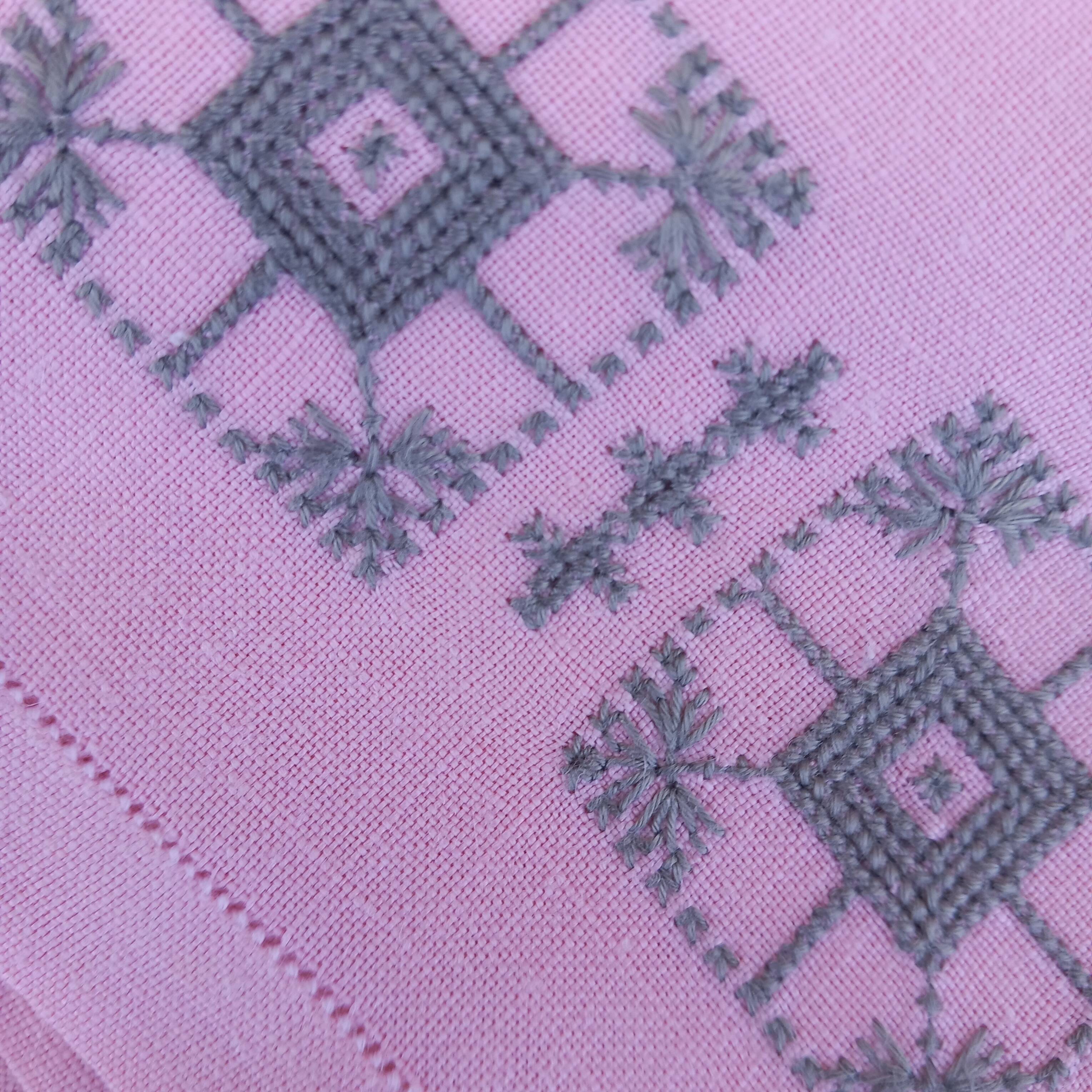 Large vintage linen tablecloth embroidered in pink and 12 matching napkins.