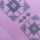 Large vintage linen tablecloth embroidered in pink and 12 matching napkins.