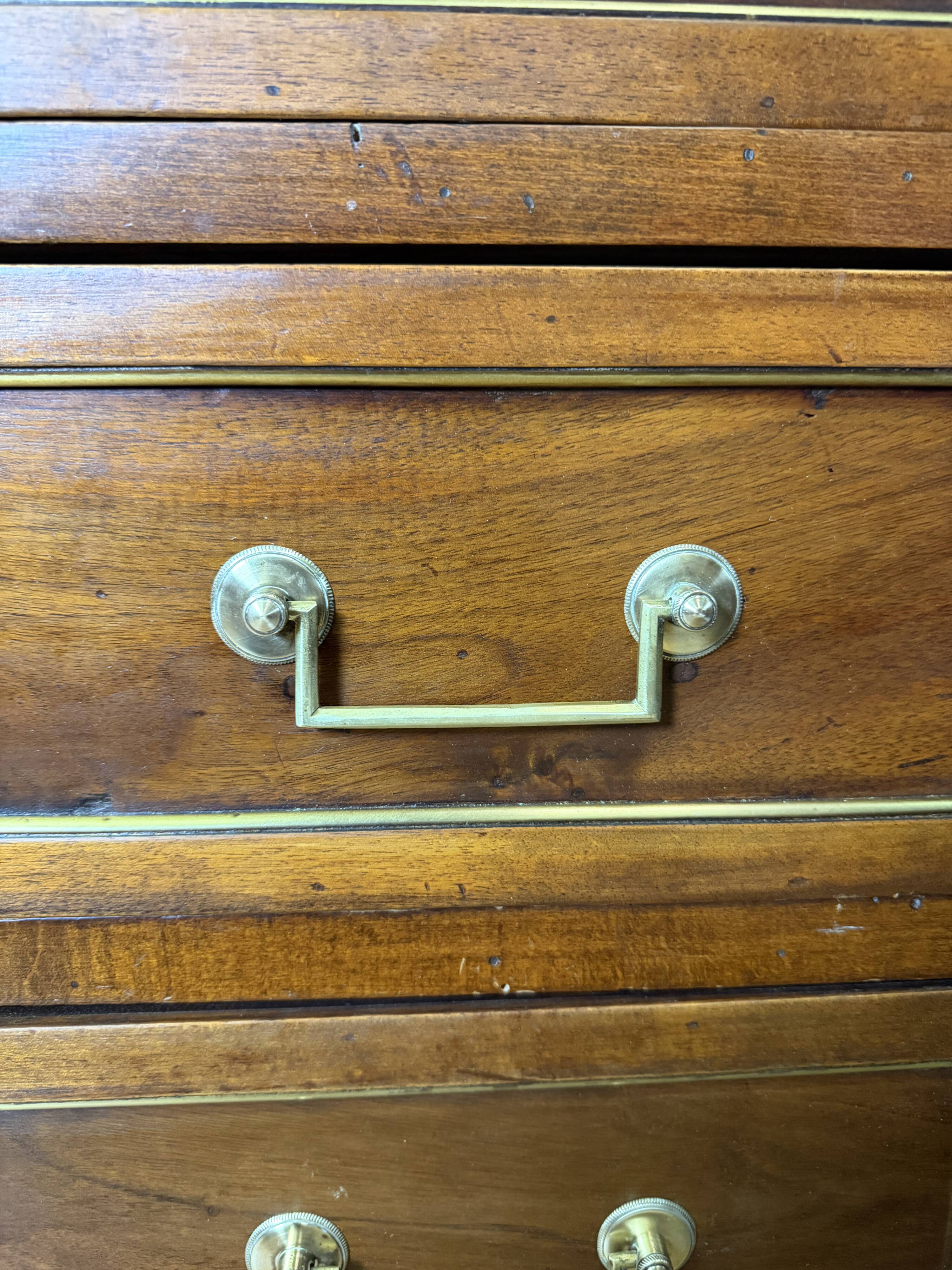 Louis XVI commode in walnut, beech, and brass.